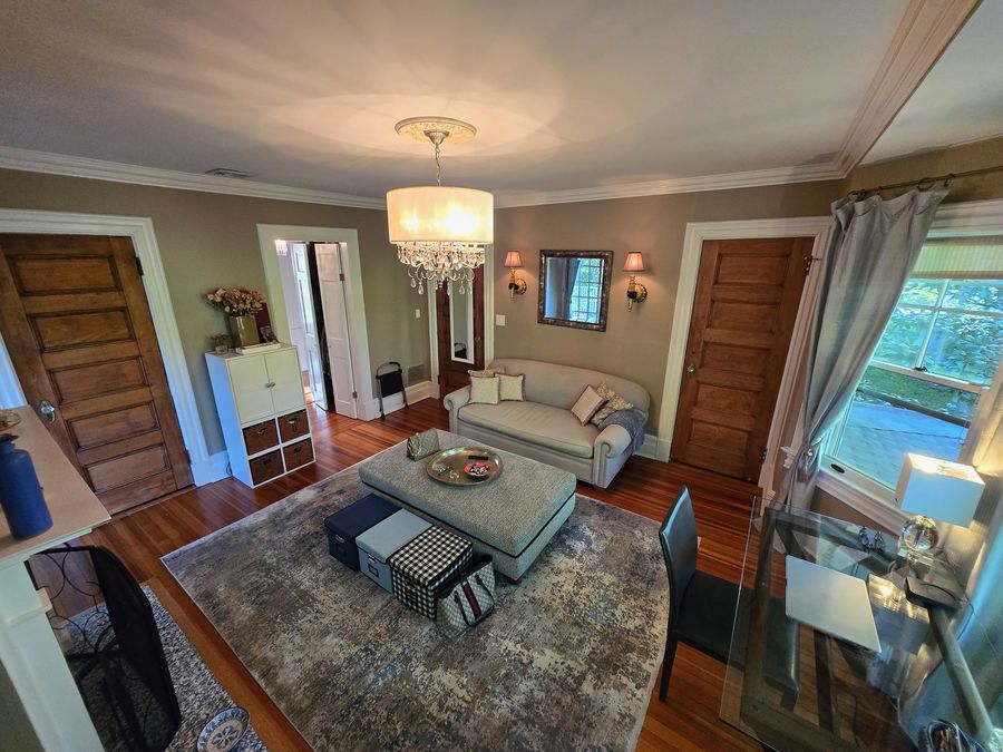 Sitting room with restored wood doors and original trim